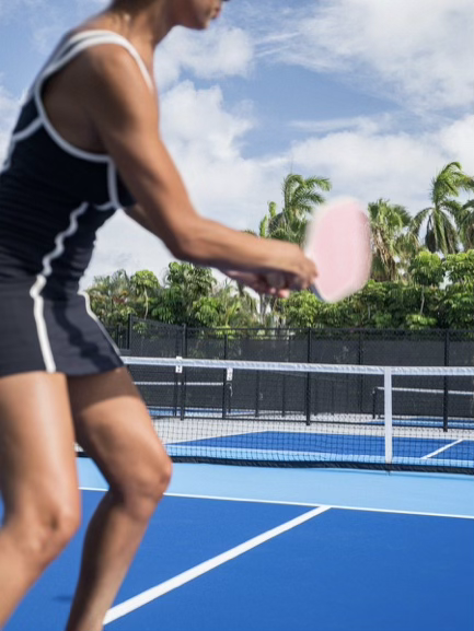 Guest playing pickleball