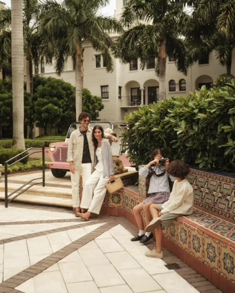 Family seated in a Boca Raton courtyard